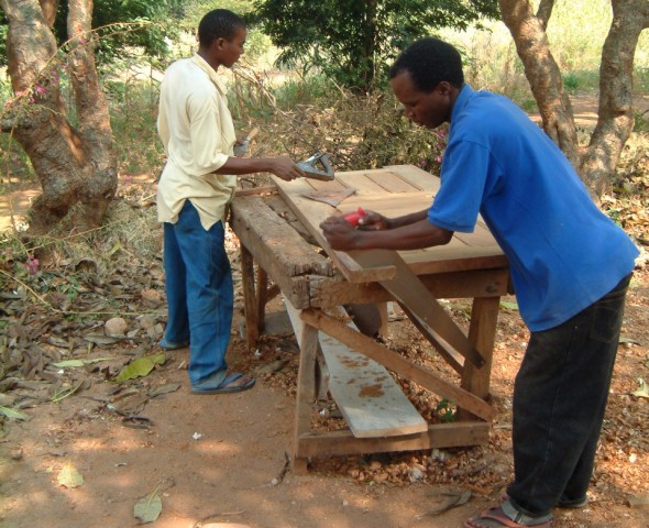 Gilbert Samile and Musa Making Door