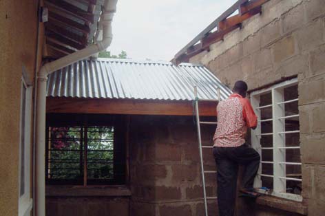 Adjusting the Fasçia Board on the Access Bridge Roof