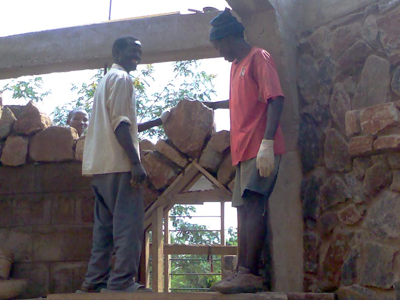 Placement of Keystone to Internal Door Arch by Mason Mwangale (right) and his assistant