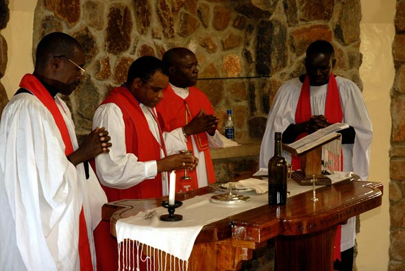 +Jacob Chimeledya & Can. John Madihi conduct the first communion in St. Luke's Chapel