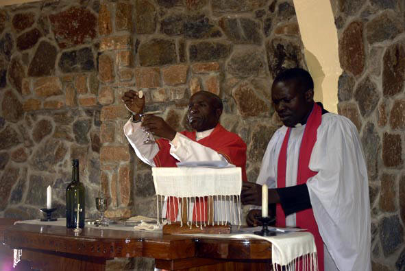 Can. John Madihi blesses the Bread & Wine